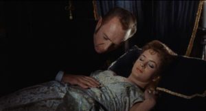 Dr. Hichcock (Robert Flemyng) miscalculates to sedative dose during necrophiliac play with his wife Margaretha (Maria Teresa Vianello) in Riccardo Freda's The Horrible Dr. Hichcock (1962)