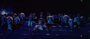 Toni (Joy Bang) is the focus of audience attention at a late night movie screening in Willard Huyck and Gloria Katz’s Messiah of Evil (1974)