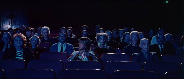 Toni (Joy Bang) is the focus of audience attention at a late night movie screening in Willard Huyck and Gloria Katz’s Messiah of Evil (1974)