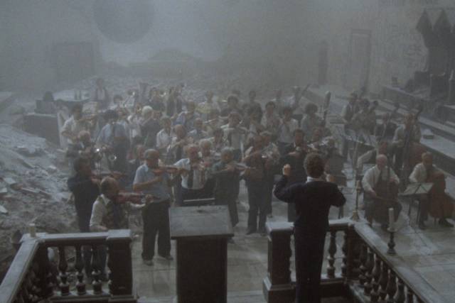 Fractious musicians finally resume playing unite in the ruins in Federico Fellini's Orchestra Rehearsal (1978)