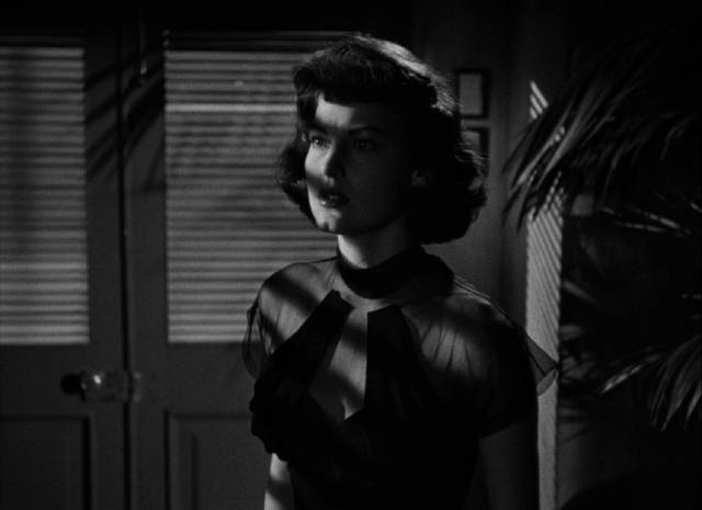 Linda Grahame (Ava Gardner) suffers from amnesia following an air raid in John Brahm's Singapore (1947)