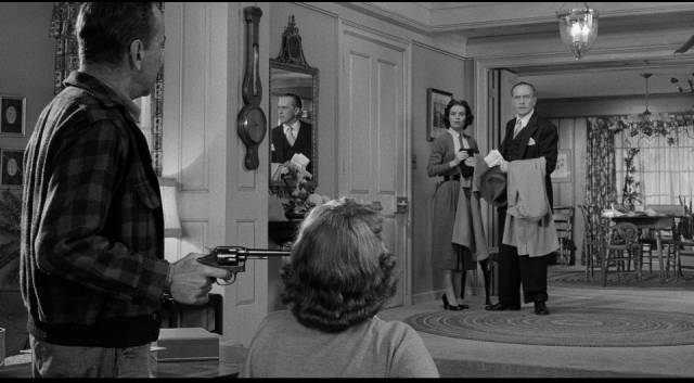 Glenn Griffin (Humphrey Bogart) takes the Hilliard family hostage in William Wyler's The Desperate Hours (1955)