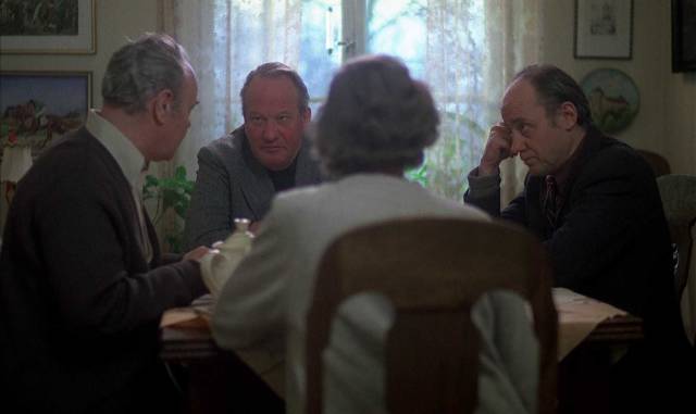 Beck and Detective Einar Rönn (Håkan Serner) question the suspect's parents in Bo Widerberg's Man on the Roof (1976)