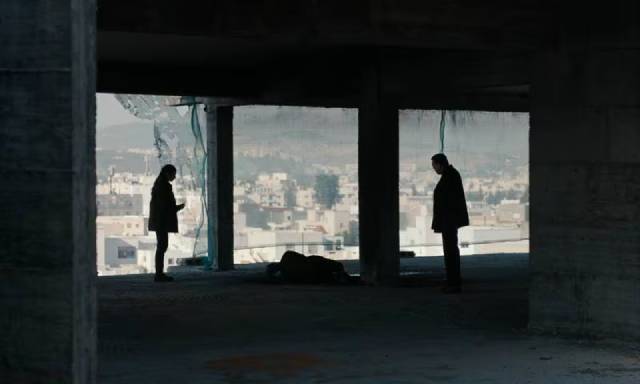 Officer Fatma (Fatma Oussaifi) and her partner Batal (Mohamed Grayaâ) investigate a strange death in Youssef Chebbi’s Ashkal: The Tunisian Investigation (2022)