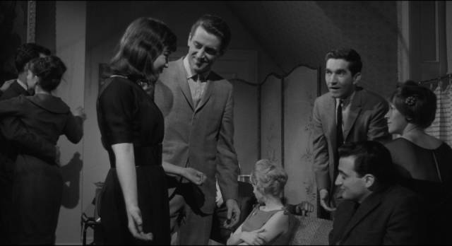 Frank Bono (Allen Baron) is uncomfortable at a party thrown by Lorrie (Molly McCarthy) in Allen Baron's Blast of Silence (1961)