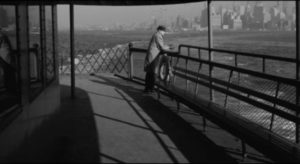 Frank Bono (Allen Baron) waits for his contact on the ferry in Allen Baron's Blast of Silence (1961)