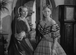 Laurie Fairlie (Sylvia Marriott) and her sister Marian (Hilary Eaves) have good reason to distrust the false Sir Percival Glyde (Tod Slaughter) in George King's Crimes at the Dark House (1940)