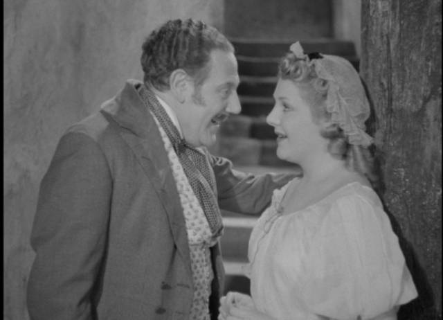 The false Sir Percival Glyde (Tod Slaughter) seduces housemaid Jessica (Rita Grant) in George King's Crimes at the Dark House (1940)