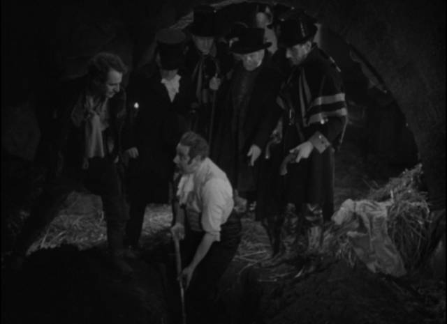 Squire Corder (Tod Slaughter) is forced to exhume his victim in the barn in Milton Rosmer’s Maria Marten, or the Murder in the Red Barn (1935)