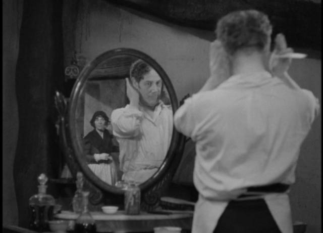 Sweeney Todd (Tod Slaughter) eyes everyone, even his partner Mrs. Lovatt (Stella Rho), as a potential victim in George King’s Sweeney Todd: The Demon Barber of Fleet Street (1936)