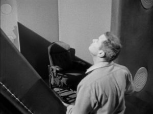 Agent Mel Hunter (Marshall Thompson) travels on missions in a briefcase in World of Giants (1959)