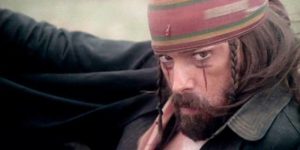 Chaco (Tomas Milian), a dangerous chaos agent, disrupts the growing friendship among the exiles in Lucio Fulci's The Four of the Apocalypse (1975)