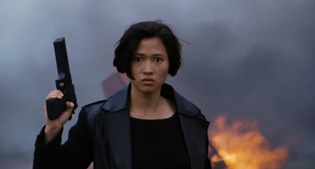 A brain chip turns Erica (Jade Leung) into a killing machine in Stephen Shin's Black Cat 2 (1992)