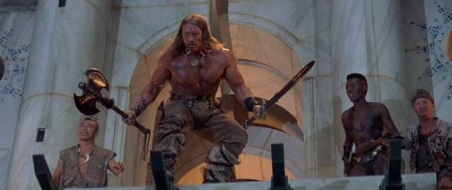Conan (Arnold Schwarzenegger) leads his companions into the villain's lair in Richard Flesicher's Conan the Destroyer (1984)