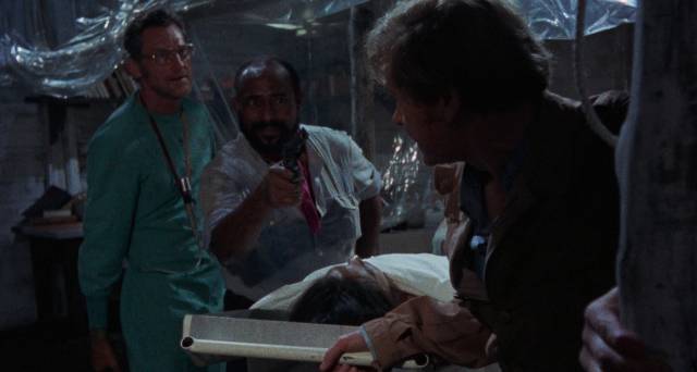 Dr. Obrero (Donald O'Brien) wants Ian McCulloch's brain in Marino Girolami's Zombie Holocaust (1980)