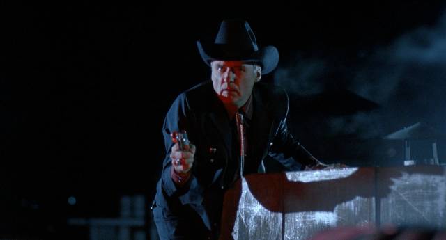 Contract killer Lyle from Dallas (Dennis Hopper) encounters annoying complications in John Dahl's Red Rock West (1993)