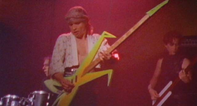 Orpheus (Robert McGinley) plays his magical guitar in Robert McGinley’s Shredder Orpheus (1990)