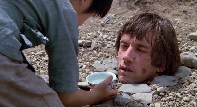 Rick (Scott Glenn) patiently endures his punishment in John Frankenheimer's The Challenge (1982)