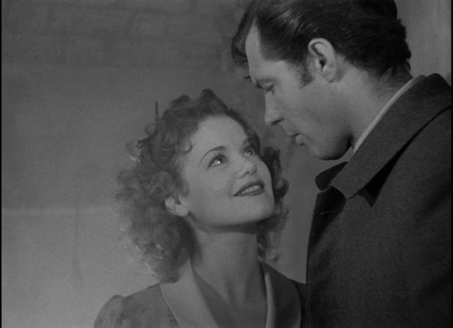 Mr. Scratch (Walter Huston)'s agent Belle (Simone Simon) seduces Jabez (James Craig) in William Dieterle's All That Money Can Buy (1941)