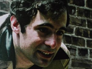 Paco (Mitch Maglio) tells Frankie (Rick Giovinazzo) time is running out in Buddy Giovinazzo's Combat Shock (1986)
