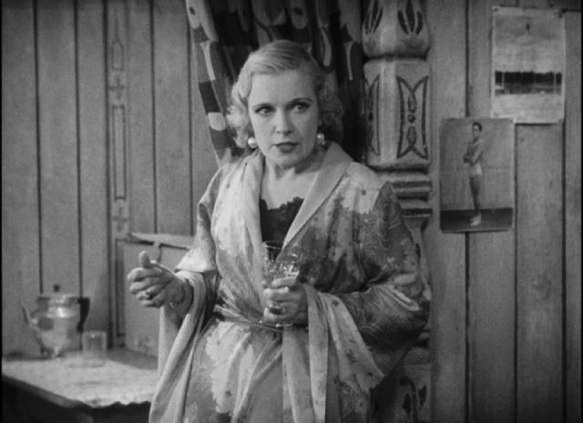 Cleopatra (Olga Baclanova)'s greed conflicts with her revulsion for her husband Hans (Harry Earles) in Tod Browning's Freaks (1932)