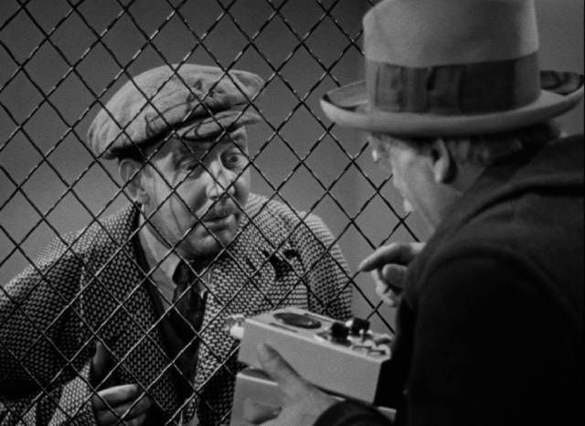 David Mallory (Boris Karloff) shows his device to small-time crook Petty Louie (Hobart Cavanaugh) in Lloyd Corrigan's Night Key (1937)