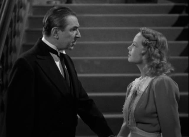 Butler Rolf (Bela Lugosi) tries to discipline servant Milly Carson (Janet Shaw) in Ford Beebe's Night Monster (1942)