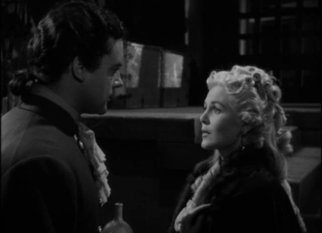 Sir Ronald Burton (Richard Greene) falls in love with the bused Countess Elga (Paula Corday) in Nathan Juran's The Black Castle (1952) 