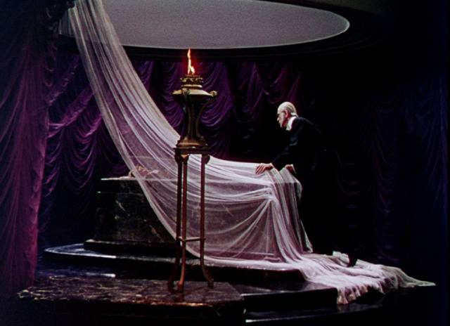 Dr. Friedrich Hohner (Boris Karloff) fixates on the lover he murdered in George Waggner's The Climax (1944)