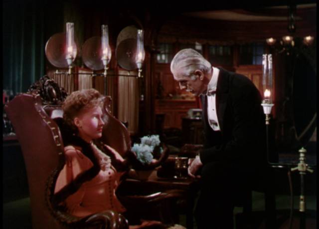 Dr. Hohner (Boris Karloff) uses hypnosis to destroy the voice of singer Angela Klatt (Susanna Foster) in George Waggner's The Climax (1944)