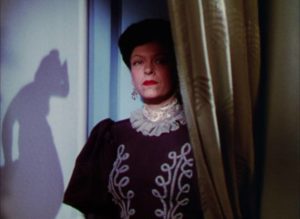 Housekeeper Luise (Gale Sondergaard) bides her time waiting to expose Dr. Hohner (Boris Karloff) in George Waggner's The Climax (1944)