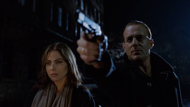 Johann (Heino Ferch) and Rafaella (Ornella Muti) have had enough of their old friend Mickey (James Russo) in Buddy Giovinazzo's The Unscarred (2000)