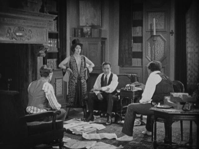 Michael Nash (Conway Tearle) explains his plans for a big con to Zara (Aileen Pringle), Zazarack (Mitchell Lewis) and Anton (Robert Ober) in Tod Browning's The Mystic (1925)