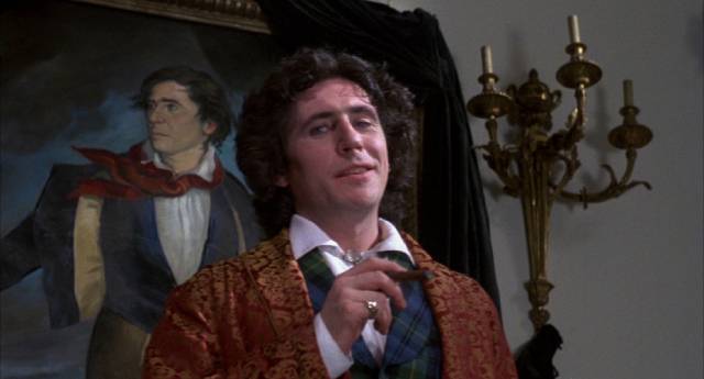 Lord Byron (Gabriel Byrne) greets his guests in Ken Russell's Gothic (1987)