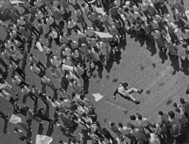 Political pamphlets flutter like birds over a murdered student in Mikhail Kalatozov's I Am Cuba (1964)