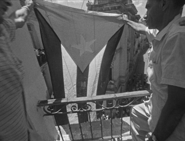 Tobacco workers display a revolutionary flag in solidarity with the students in Mikhail Kalatozov's I Am Cuba (1964)