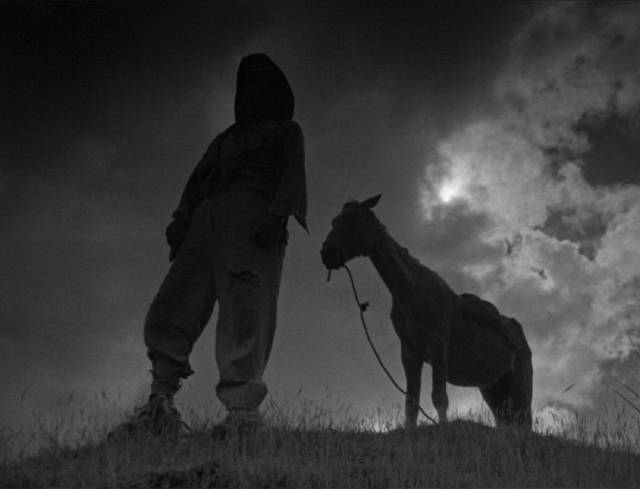 Sergei Urusevsky's signature shot, framing a character in silhouette against a dramatic sky in Mikhail Kalatozov's I Am Cuba (1964)