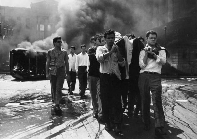 A crowd bears away a murdered student in the wake of a riot in Mikhail Kalatozov's I Am Cuba (1964)