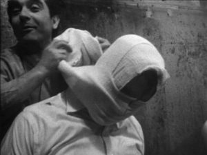 Henry Woolf torments the kidnapped minister for amusement in Tony Bicât’s Skinflicker (1973)