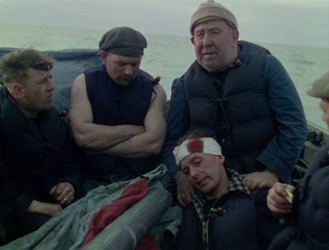 Torpedoed merchant seamen survive in an open lifeboat in Pat Jackson's Western Approaches (1944)