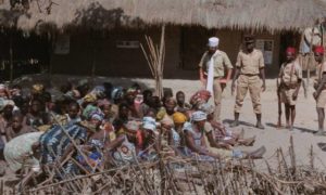A French officer and his Native troops put pressure on village women in Ousmane Sembène's Emitaï (1971)