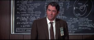 Mission supervisor Charles Keith (Gregory Peck) weighs the cost of sacrificing the crew in John Sturges' Marooned (1969)