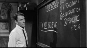Academic Norman Taylow (Peter Wyngarde) insists on a strictly rational view in Sidney Hayers' Night of the Eagle (1962)
