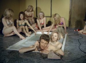 Journalist Freddie Horne (David Kernan) does some research in Pete Walker's For Men Only (1967)