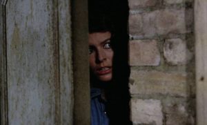 Julia (Ann Michelle) tries desperately to escape in Pete Walker's House of Whipcord (1974)