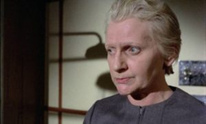 Penelope Keith makes her first appearance in a Pete Walker movie as sadistic guard Walker in House of Whipcord (1974)