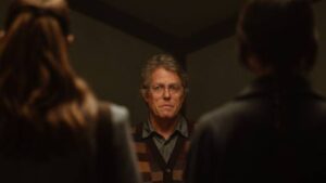 Hugh Grant argues theology with a couple of young Mormon missionaries in Heretic (2024)