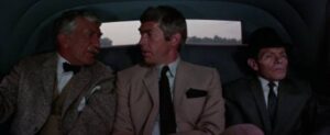Dr Sidney Schaeffer (James Coburn) is recruited by agency heads Ethan Allan Crocket (Eduard Franz) and Henry Lux (Walter Burke) in Theodore J. Flicker’s The President’s Analyst (1967)