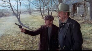 J.B. Books (John Wayne) teaches the widow's son Gillom (Ron Howard) how to shoot in Don Siegel's The Shootist (1976)