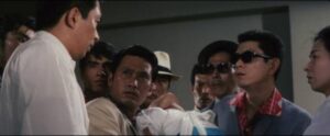 Dr. Amamiya (Noboru Andô) confronts Korean gangsters in Tai Katô's By a Man’s Face Shall You Know Him (1966)